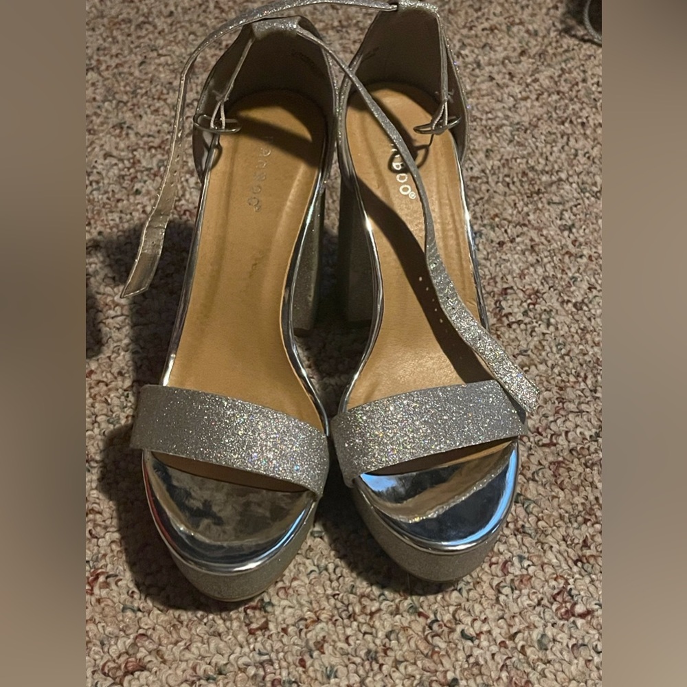 Bamboo glittery silver heals size 10 with strap around ankle with 3” heel